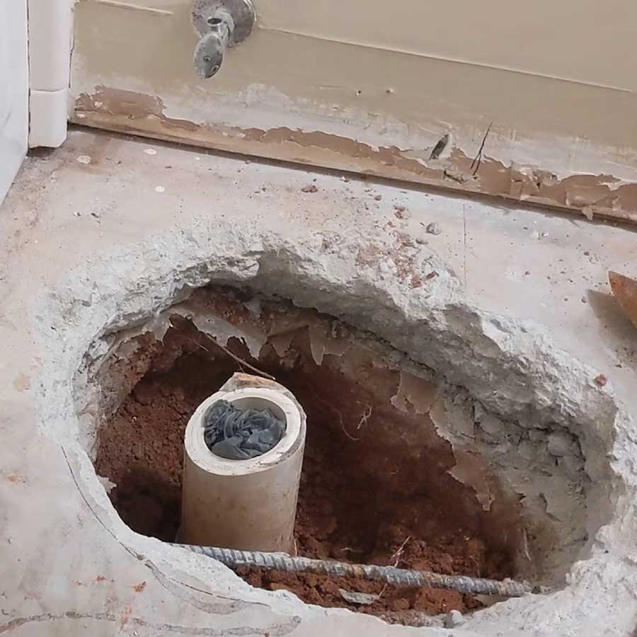 Concrete slab cut for toilet drainage relocation